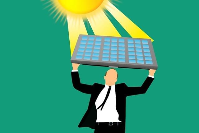 a man holding a solar panel piece facing the sunshine